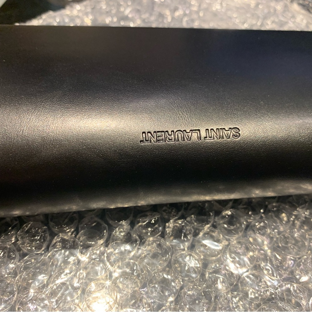 Used once saint laurent women’s sunglasses has case and lens wiper